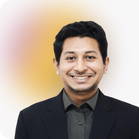 Ishtiak, Full-Stack Developer, in black blazer and gray shirt on a soft gradient background.