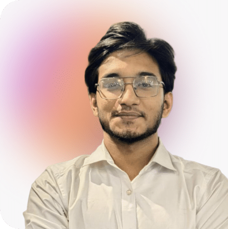 Naushad Karim, Full-Stack Developer, wearing glasses and a white shirt on soft gradient background